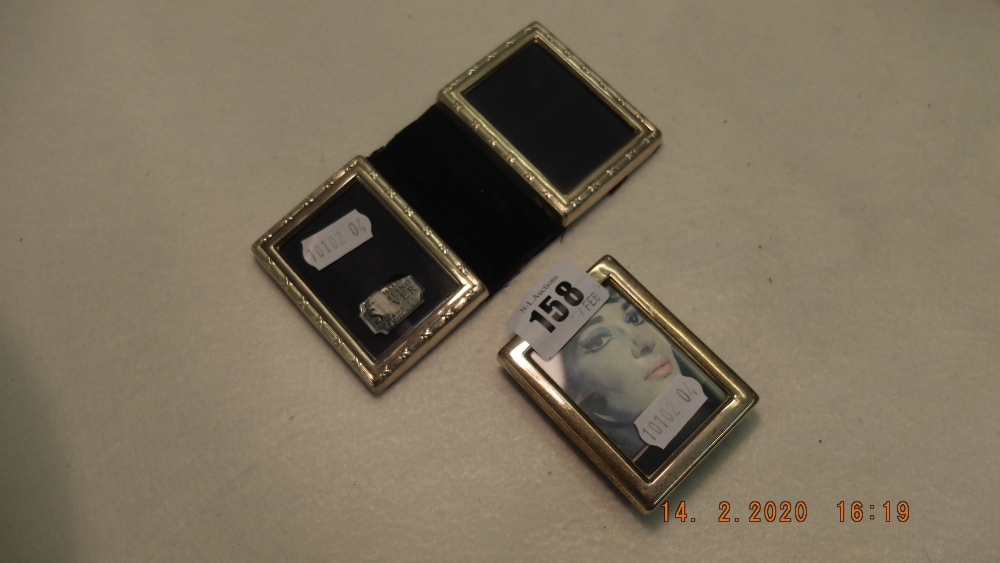 A miniature silver photo frame and double photo frame