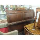 A mahogany sleigh bed