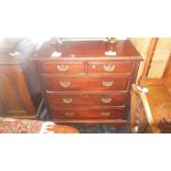 An Edwardian walnut chest of five drawers