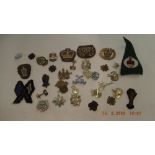 A collection of militaria including badges and embroidery