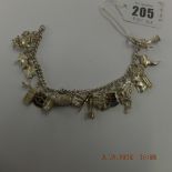 An early hm silver charm bracelet with 21 assorted very fine charms,