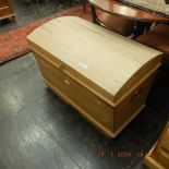 A dome top pine blanket box