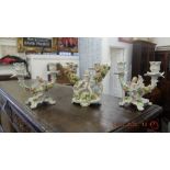 A pair of Meissen style candlearbras and another