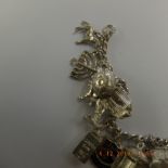 An early hm silver charm bracelet with 21 assorted very fine charms,