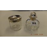 A scent bottle with hm silver top and a silver topped lidded jar