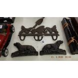 A pair of Victorian cast iron dog book ends and an early cast coat hanger