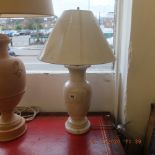 A pair of marble lamps and shades