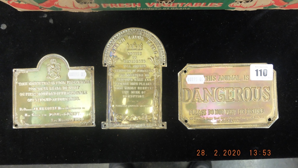 Three antique humorous brass plaques