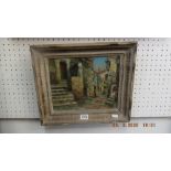 A small framed oil on canvas Spanish street scene signed lower left hand corner