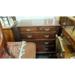 An Edwardian walnut chest of five drawers