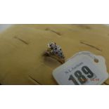 An 18ct gold multi gem set jaguar ring weight 3 grams size K 1/2