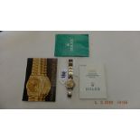 A ladies gold and stainless steel Rolex Oyster Perpetual with paperwork