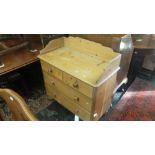 A pine chest of four drawers