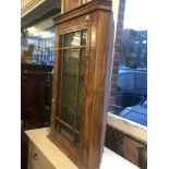 A walnut corner cabinet