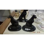 A pair of bronze statues of dogs,