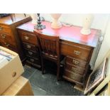 A mahogany pedestal desk with leather insert