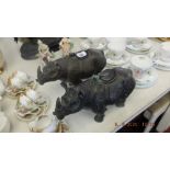 A pair of bronze rhino incense burners