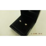 A pair of 18ct white gold and marquees cut diamond stud earrings