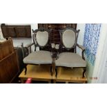 A pair of upholstered armchairs,