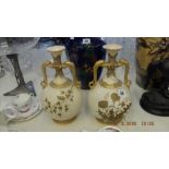 A pair of Royal Worcester blush ivory vases