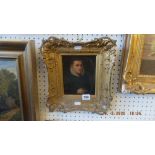 A gilt framed portrait study on board of a gentleman wearing a ruffle