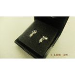 A pair of 18ct white gold and diamond stud earrings