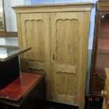 A 19th century pine double wardrobe.