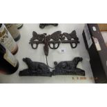 A pair of Victorian cast iron dog book ends and an early cast coat hanger