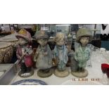 A set of four Henri Studio (signed) little dreamers statues, fire fighter, doctor,