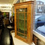 A walnut corner cabinet