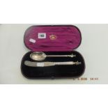 A boxed Victorian hallmarked silver apostle spoon and knife George Adams 1881