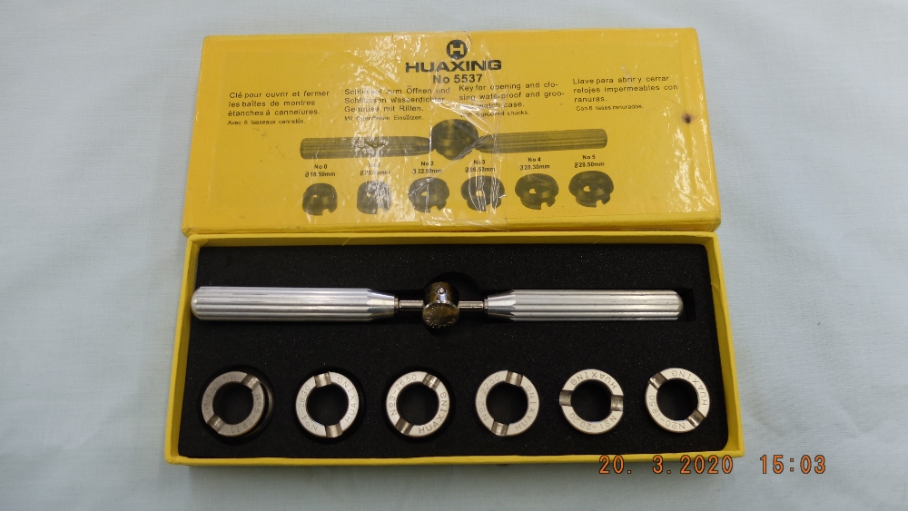 A boxed watch opening tool for Rolex