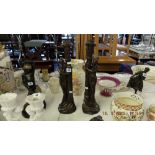 A pair of art deco style figural candle sticks