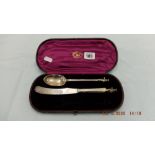 A boxed Victorian hallmarked silver apostle spoon and knife George Adams 1881