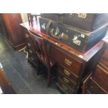 A mahogany pedestal desk with leather insert