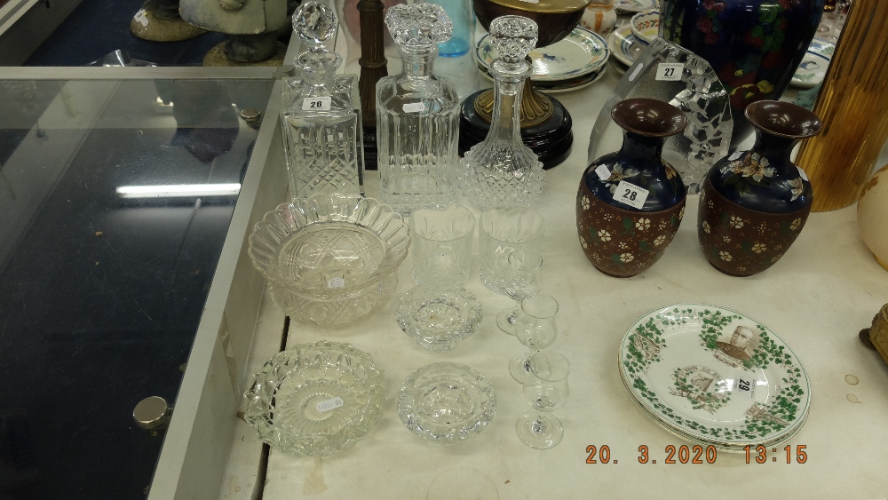 A quantity of assorted glassware including three decanters