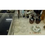 A quantity of assorted glassware including three decanters