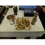 A large brass ashtray,
