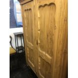 A 19th century pine double wardrobe.