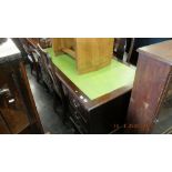 A large mahogany leather top desk