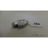 A continental silver snuff/ pill box, set with eastern scene,