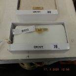 A DKNY white purse, leather, brand new unused, still has labels etc.