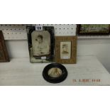 Two photo frames and a hand coloured photo of a Bedouin