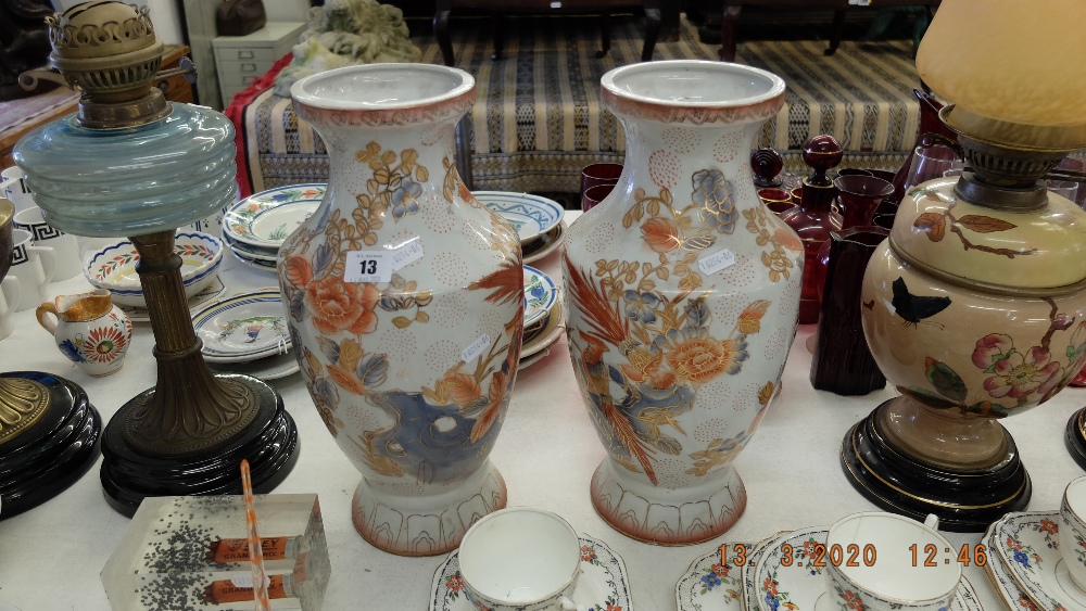 A pair of orange and white oriental vase