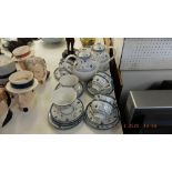 A Royal Doulton Cambridge blue and white tea and coffee service