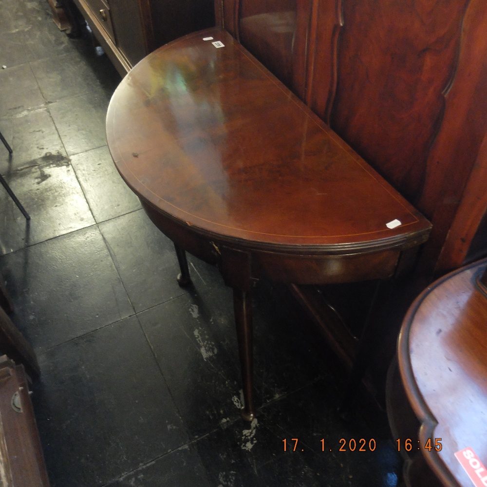 An inlaid mahogany demi lune card table