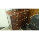 An Edwardian walnut chest of five drawers