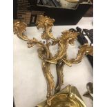 A pair of gilt wall sconces