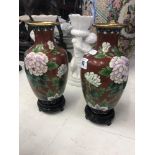 A pair of cloisonne vases on stands