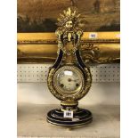 A decorative gilt and enamel clock